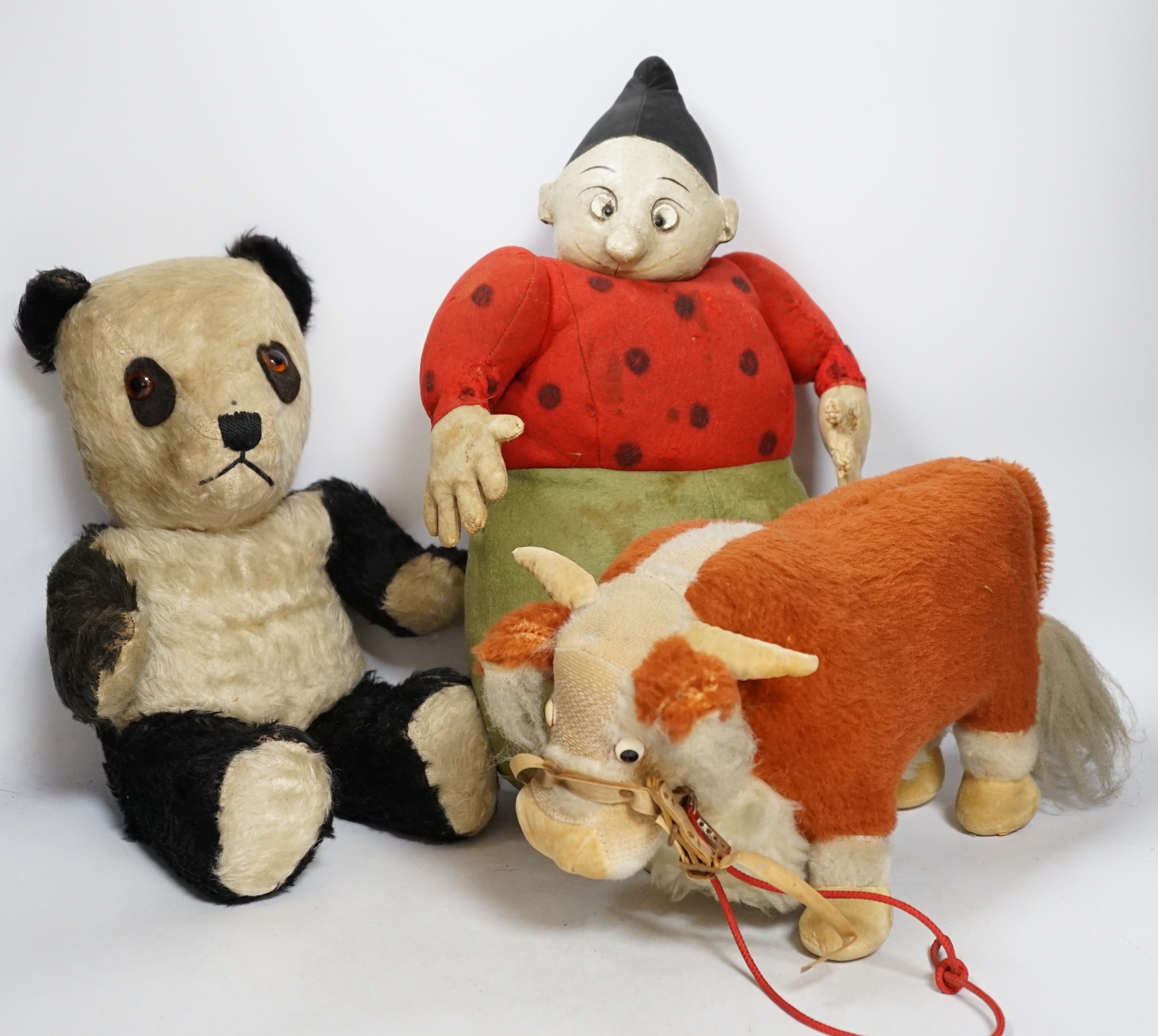 A Katzenjammer Kids 'Misses', felt body and composition face, 36cm high, a Chiltern panda, 1950's, and a Merrythought bull, 1950's (hair loss)